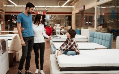 smiling-young-couple-little-boy-bed_99043-4965(1)